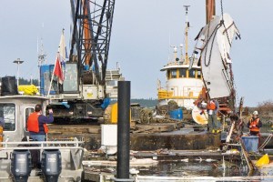 Salvage crew recovers sunken boat