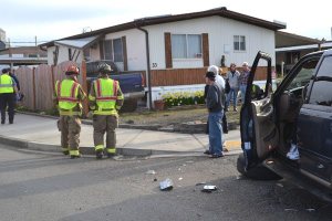 Collision forces truck into porch
