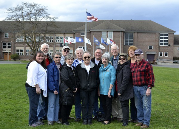 Board members and volunteers for the Sequim Museum stand near the entrance for the recently announced new exhibit building. They include