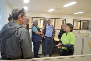 Deputy Chief Sheri Crain shows residents the squad room adjacent to holding cells.