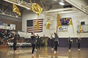 Sequim High School’s flag team performs for the Sequim High School basketball crowd at halftime on Feb. 2.