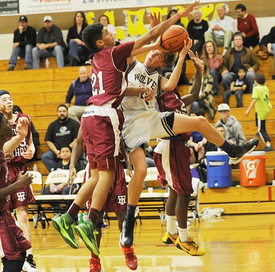 Sequim guard Jackson Oliver takes the ball to the hoop as Sequim’s Wolves take on — and defeat — Mount Tahoma at home on Dec. 11. Oliver finished with 15 points