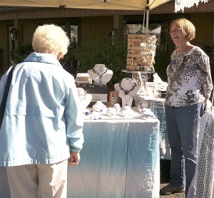 Connie Rodibaugh of CR Wearables Sea Glass Jewelry greets a customer.