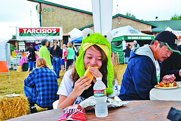 Laura Yoshida of the Tri-Cities takes a break at the Lavender in the Park event in 2011. Farmers with the Sequim Lavender Farmers Association are disbanding the event in 2015 to focus on building up events at their individual farms.