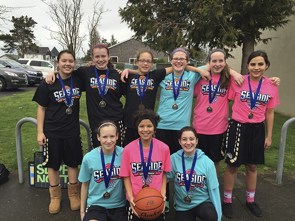 The Avalanche Black 7th team members celebrate a tourney win in Seaside