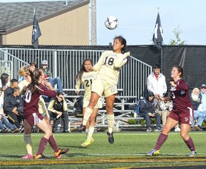 Kai Mahuka (18) of Peninsula gets her head on a ball as the Pirates take on Whatcom on Oct. 28.