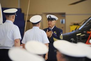 Master Chief Lawrence 'LP' Moroles accepts and American Flag at his retirement ceremony on June 11 in Port Angeles.