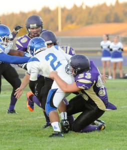 Sequim defenders Brandon Stamper (33)