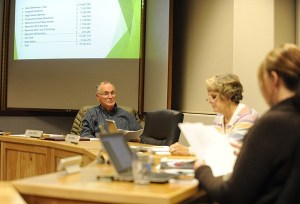 Sequim School Board president John Bridge talks with fellow board members at their Nov. 17 meeting. Board directors approved a school construction bond proposal