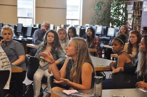 Sequim High School Leadership sophomore Annie Armstrong expresses her thoughts on ways to support students in Career and College Readiness during zero hour in the library on May 12. In the background is Superintendent Gary Neal. Neal and other administrators and school board directors have made a practice of attending some of the Leadership class sessions to hear suggestions from students on various school-related subjects. Leadership Class is taught by Jennifer Van De Wege.