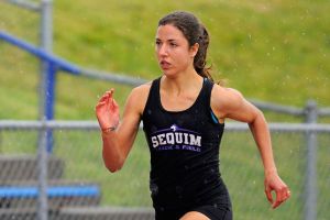 Sequim High senior Waverly Shreffler fights through wet