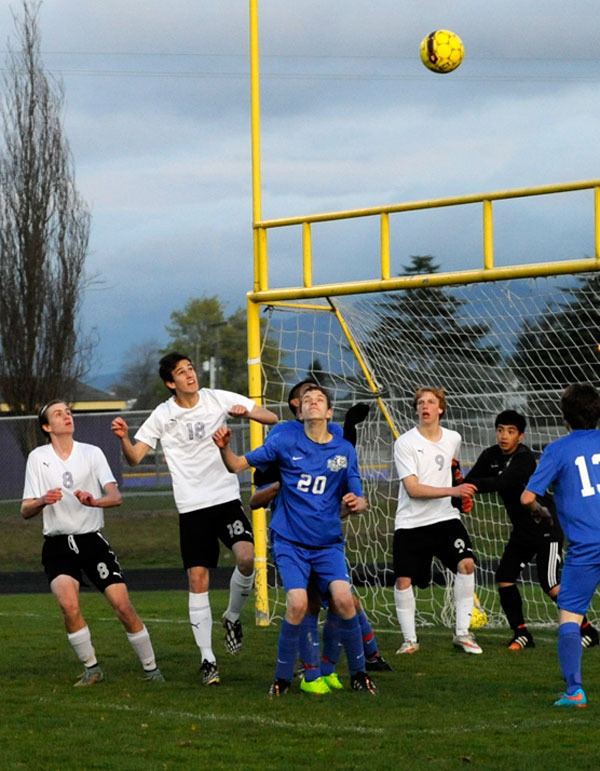 Hayden James looks to head in a corner kick from Adrian Espinoza to go up 5-0 against the North Mason Bulldogs on March 31.