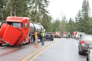 Law enforcement officials block U.S. Highway 101 near Blyn after a four-vehicle crash on June 10.