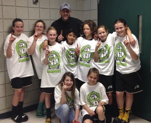 The Olympic Avalanche basketball squad celebrates its sixth tourney title of the 2014 season. Pictured are (back row