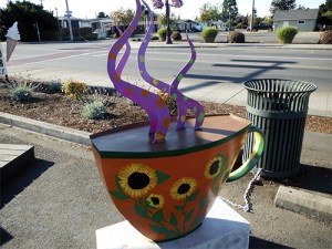 Local artist Craig Dills volunteered to paint White Cup Espresso's previously bland large street coffee cup statue and did a fantastic job