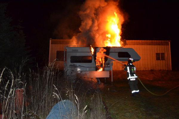 Lieutenant/paramedic Joel McKeen extinguishers a fire off of O’Brien Road.