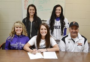 Sequim High senior McKenzie Bentz signs a letter of intent on April 29 to play softball at Bellevue College next year. Bentz