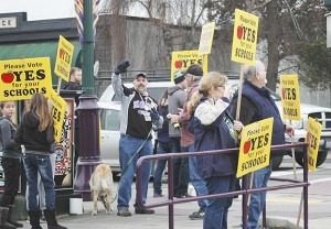 Community members waved signs Saturday