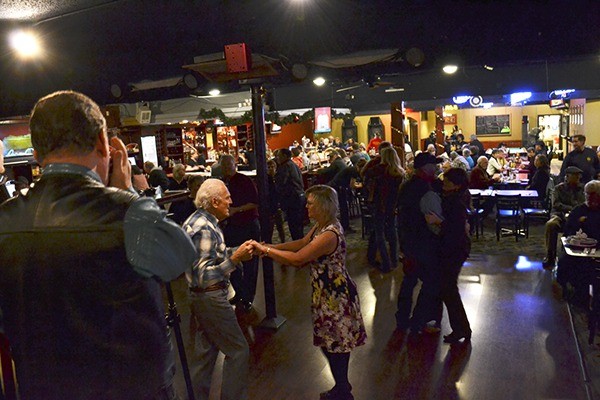 The Old Sidekicks help send off 2014 at the Oasis Bar & Grill on New Year’s Eve. They were one of the last bands to perform at the venue before owners decided to stop music due to pressures from music licensing companies to pay to play covers.