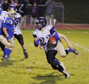Sequim's Gavin Velarde looks for running room as the Wolves take on Bremerton Thursday night. Bremerton edged Sequim 27-20