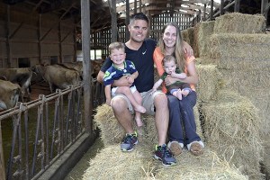Ryan and Sarah McCarthey sit with their boys Tyler