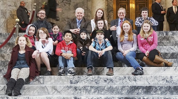 Youths from Boys & Girls Clubs in Sequim and Port Angeles meet with state representatives Kevin Van De Wege (D-Sequim) and Steve Tharinger (D-Sequim) at the Washington State Capitol Building during the 2016 regular session of the Legislature. Participating Sequim youths are Nicole Fearn
