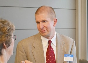 Charlie Bush speaks with City Councilor Laura Dubois at a meet-and-greet among the Sequim city manager candidates on June 18. Bush was chosen on June 22 over five other finalists.