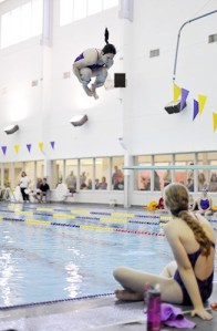 Freshman Anna White dives at a swim meet earlier this year in SARC. She took up swimming a little over a month after her brother CJ drowned in Lake Cushman in July. Their mom