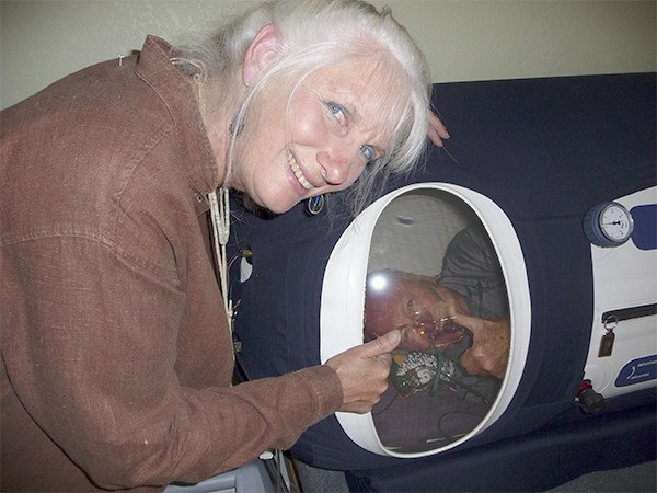 Dr. Crystal Tack points to her patient Fred Bailey