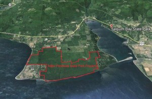 An aerial photo shows the overlay of the property boundaries on Miller Peninsula.