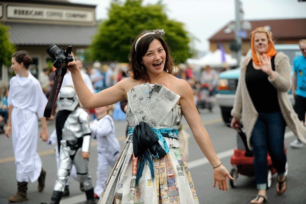 Alana Linderoth walks in the Sequim Irrigation Festival Grand Parade with the Sequim Gazette's float.