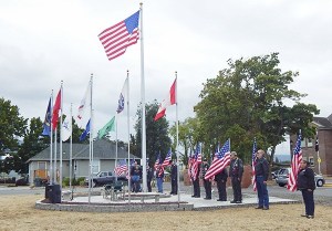 The Sequim community takes part in a dedication of the Cavalcade of Flags at the MAC’s veterans memorial wall at 544 N. Sequim-Dungeness Way.
