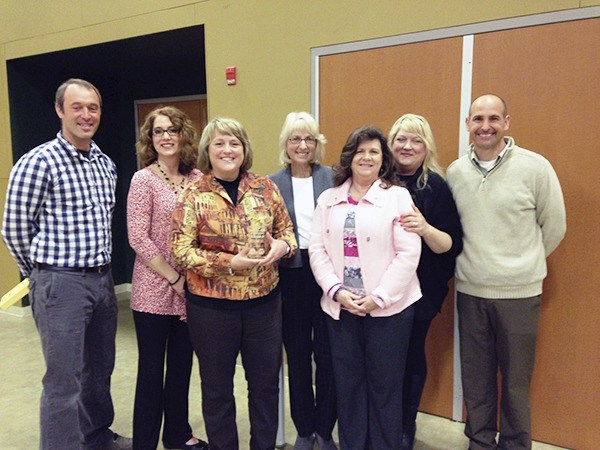 Sequim School DIstrict staffers accept their state award.