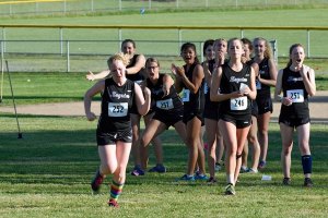 As Sequim teammates look on