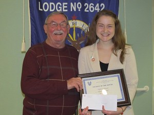 Sequim High School sophomore Alexis Cromer and Elks representative Doug Metz.