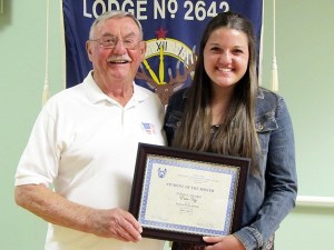 Sequim High School sophomore Erin Vig and Sequim Elks member Doug Metz.