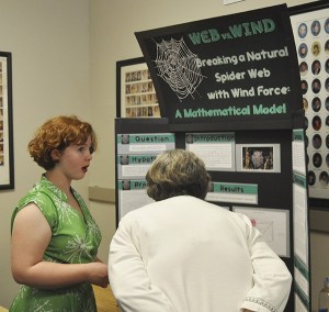 Isabelle MacMurchie shows her science project project titled