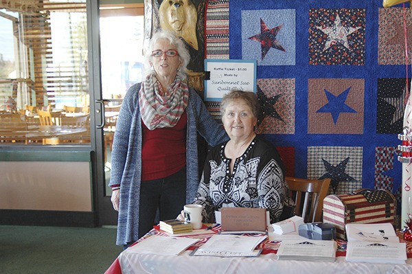 Captain Joseph House Foundation founder Betsy Reed Schultz at the Black Bear Diner Spring Benefit with help from Sam Coyle.