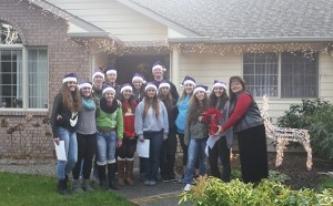 The Sequim Softball boosters are trying to raise funds for its softball program by offering Christmas caroling from the softball players. Above