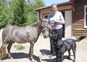 As owner Deborah White lightly controls their leads