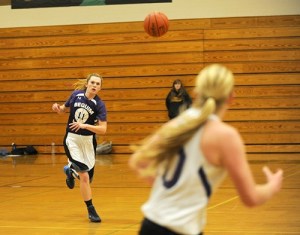Victoria Cummins passes to Kylee Williams during a recent practice. Cummins said the girls are eager to win this year with six seniors playing.