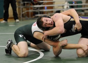 Sequim's Kevyn Ward works his way to a 15-6 major decision over Caleb Joslin of Port Angeles at the Battle for the Axe tournament on Jan. 2. Ward went 5-0 on the day with four pins.