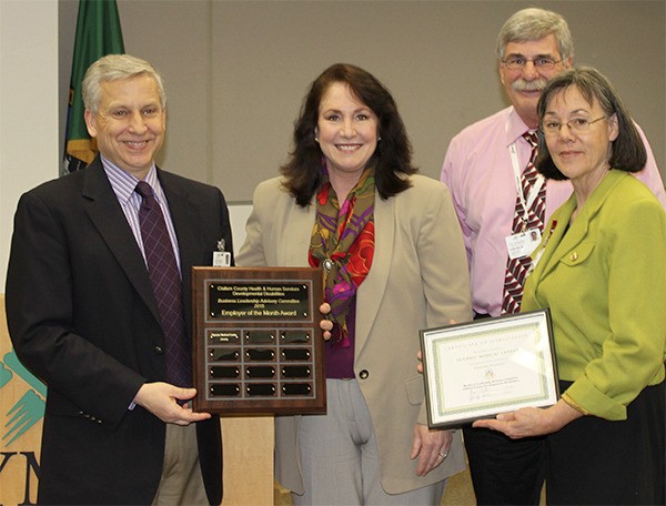 From left are OMC’s CEO Eric Lewis; Lisa Pierson