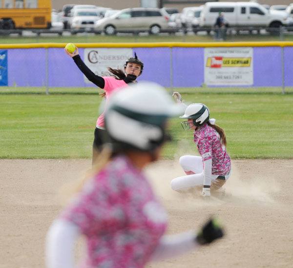 Sequim second baseman Jordan Bentz throws out a Port Angeles runner and looks to turn a double play.