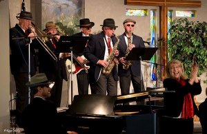 The Peninsula Men’s Gospel Singers Little Brass Band plays in Joyce last year.