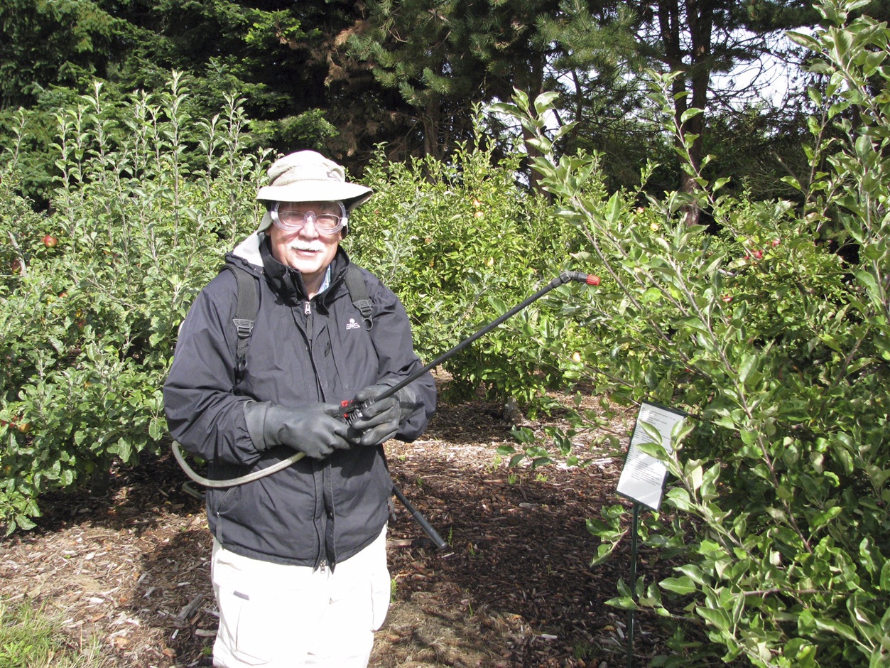 Protect yourself while applying pesticides by wearing long sleeves and pants