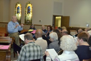 Dewey Ehling leads a practice of the Peninsula Singers in 2014 for one of the group’s performances. He took over conducting the group in 1990. Ehling died of pneumonia on Aug. 7.Sequim Gazette file photo by Matthew Nash