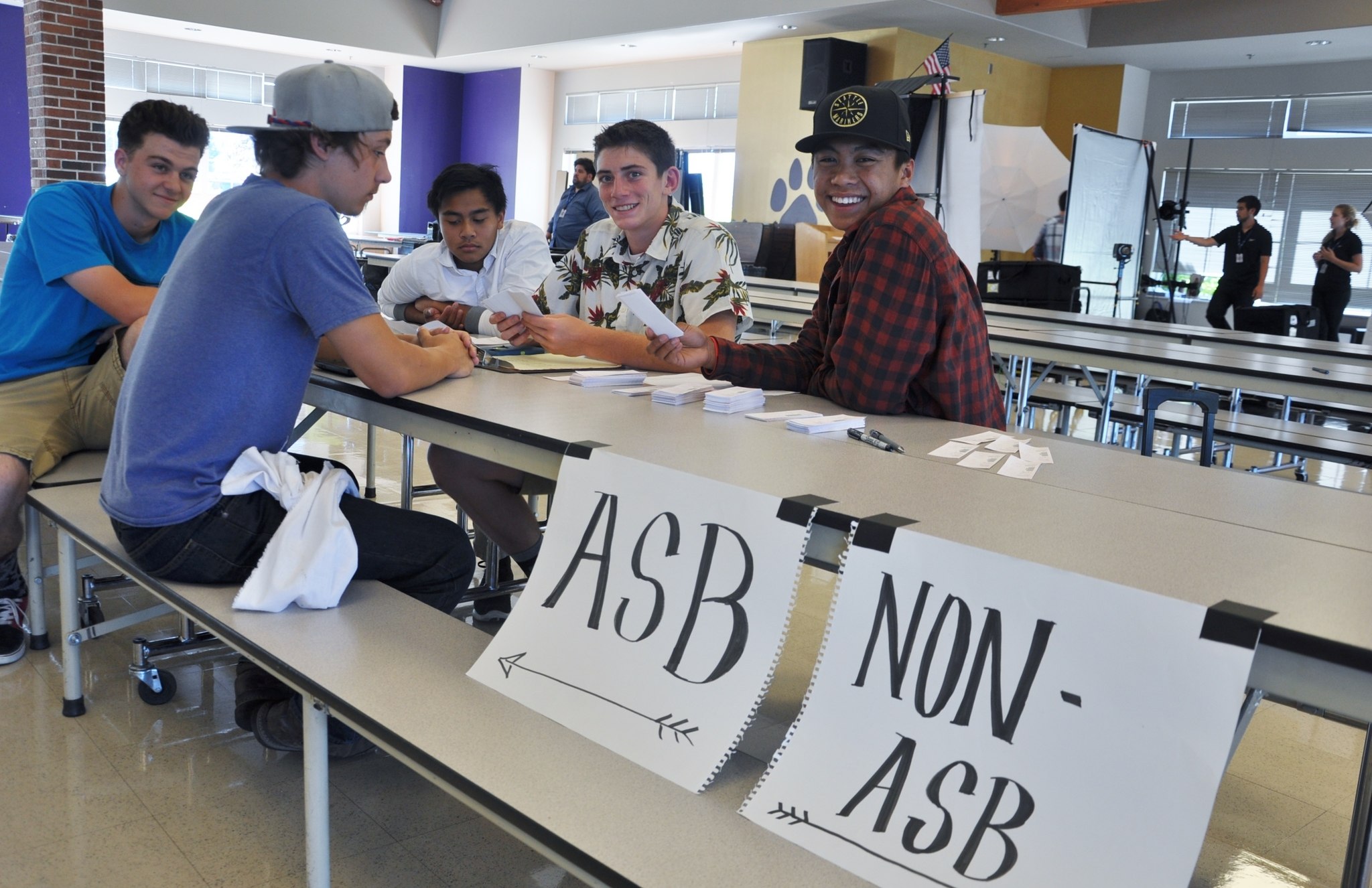 Leadership students assist with Wolf Pack Days by handing out cards for school pictures in the high school cafeteria. From left are Shaun Jones