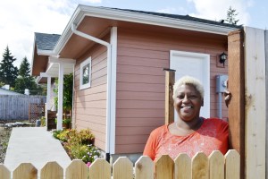 Eula Cook stands outside her new home in Port Angeles’ Maloney Heights Subdivision. After almost nine years in Sequim