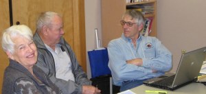 TAX-AIDE volunteer Paul Downes assists taxpayers Joane and Don Clayton. Submitted photo